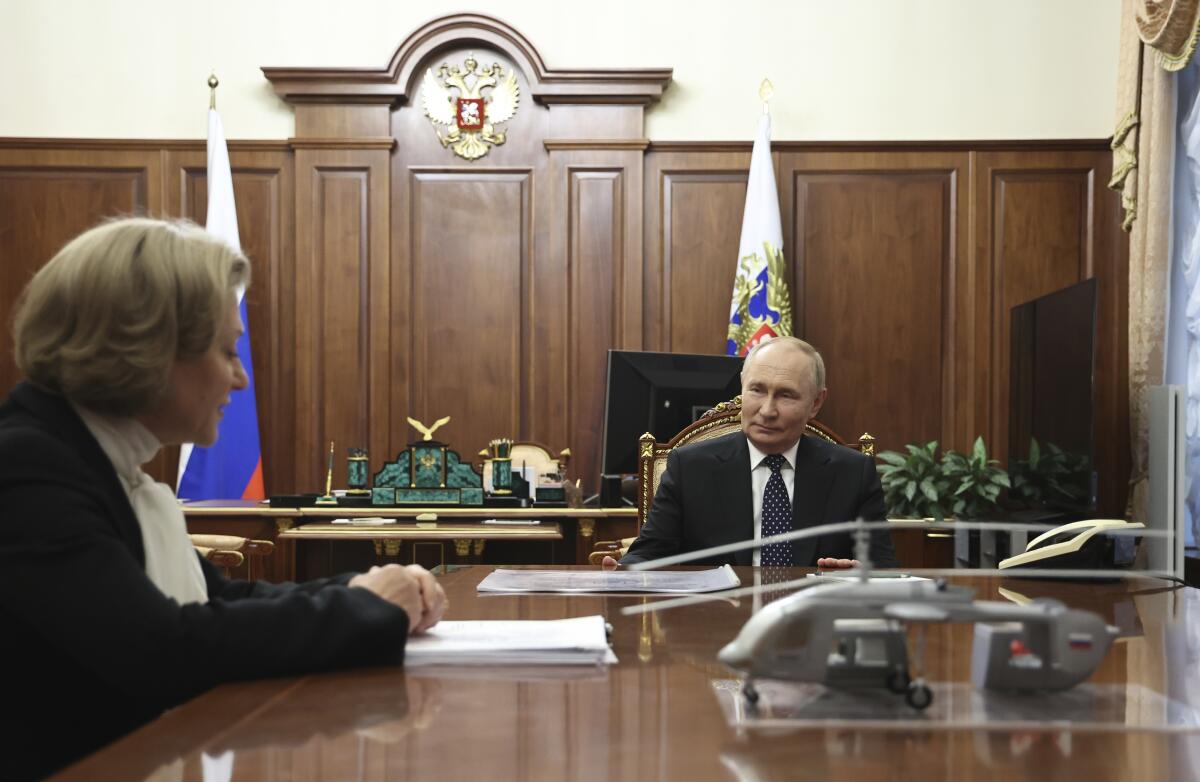 Russian President Vladimir Putin, right, during a meeting at the Kremlin in Moscow, Russia.