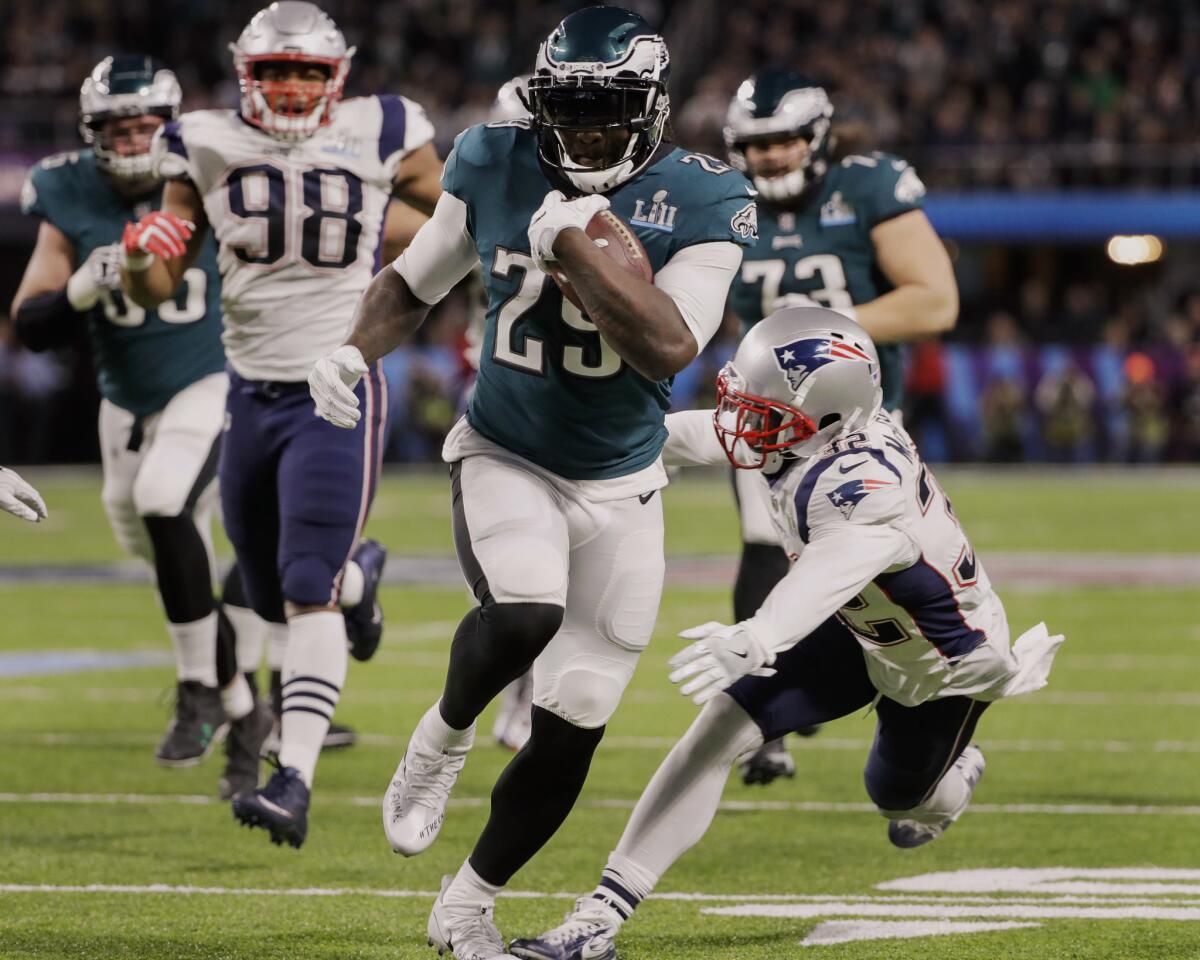 Eagles running back LeGarrette Blount breaks into the Patriots' secondary on a 21-yard touchdown run during the second quarter.