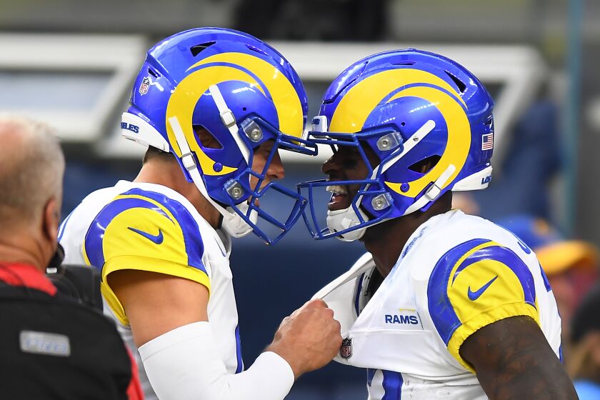 Inglewood, CA. September 12, 2021: Rams quarterback Matthew Stafford, left, celebrates his touchdown pass.