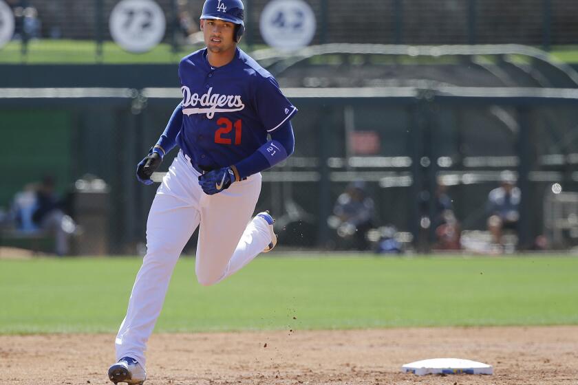 Dodgers outfielder Trayce Thompson rounds the bases after hitting a three-run homer against the Milwaukee Brewers during the first inning.