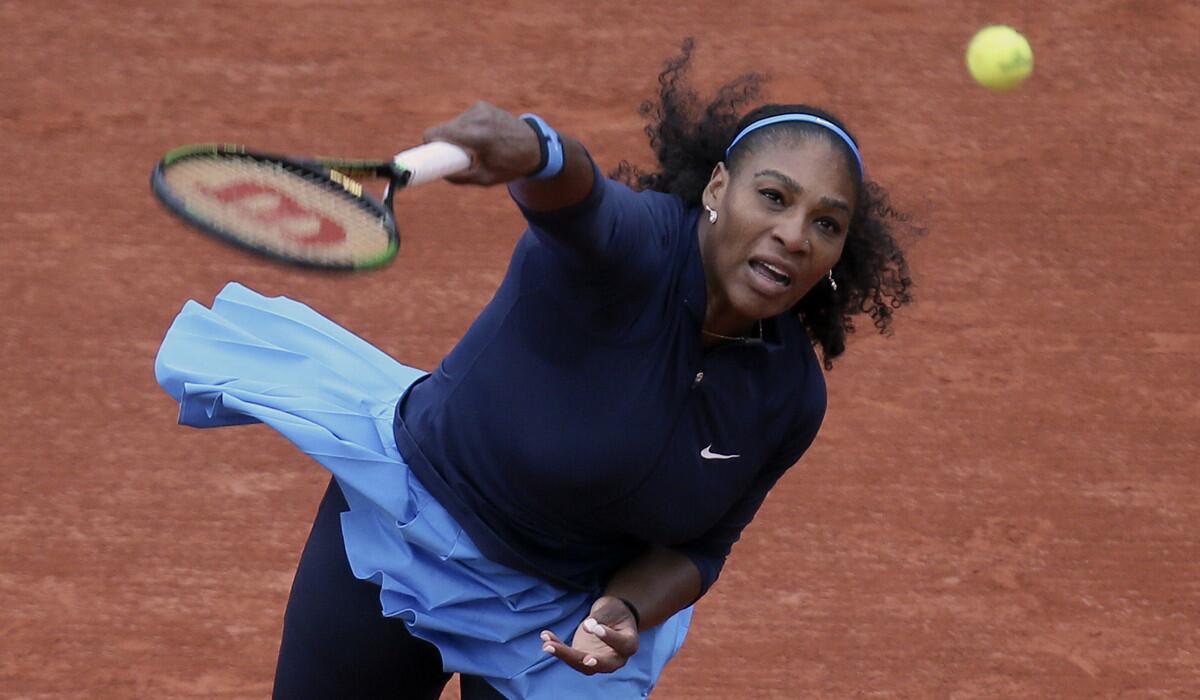 Serena Williams serves the ball to Magdalena Rybarikova during their first round of the French Open tennis tournament at the Roland Garros stadium on Tuesday.
