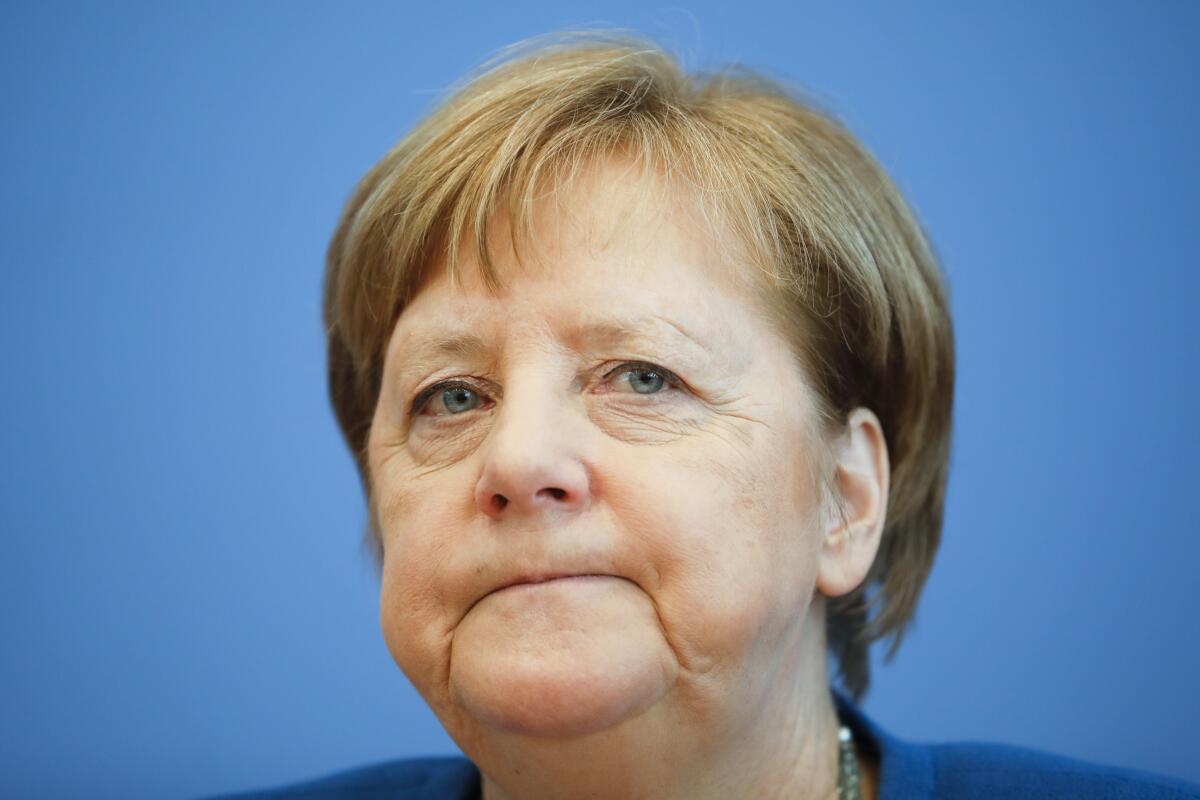 German Chancellor Angela Merkel attends a news conference about the coronavirus outbreak in Berlin on Wednesday.