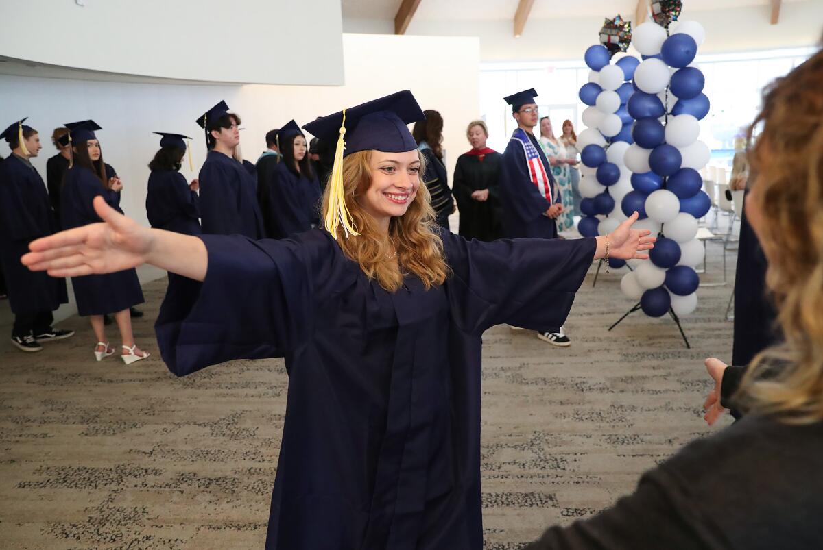 Graduate Vanessa Fultz, left, greets family during Monte Vista Independent Study School's commencement ceremony.