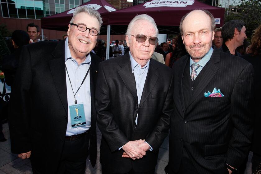 Country music producer and songwriter Billy Sherrill (center) passed away on August 4, 2015 in Nashville, Tennessee. He's shown here with songwriters Norro Wilson, left, and Bobby Braddock in 2012.