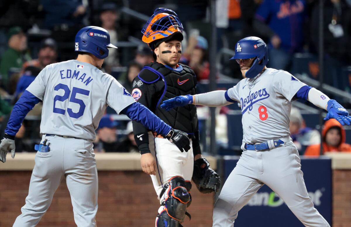 Kiké Hernández celebrates with Tommy Edman after hitting a two-run home run against the Mets.