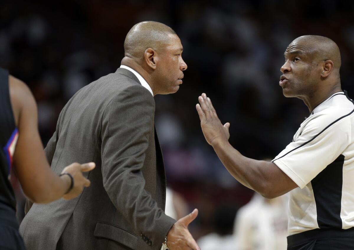 Clippers Coach Doc Rivers talks with official Tre Maddox during the second half of a game against the Miami Heat on Dec. 16.