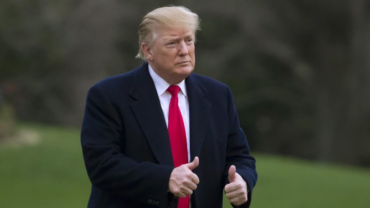 President Trump gives two thumbs up after stepping off Marine One on the South Lawn of the White House on Sunday.