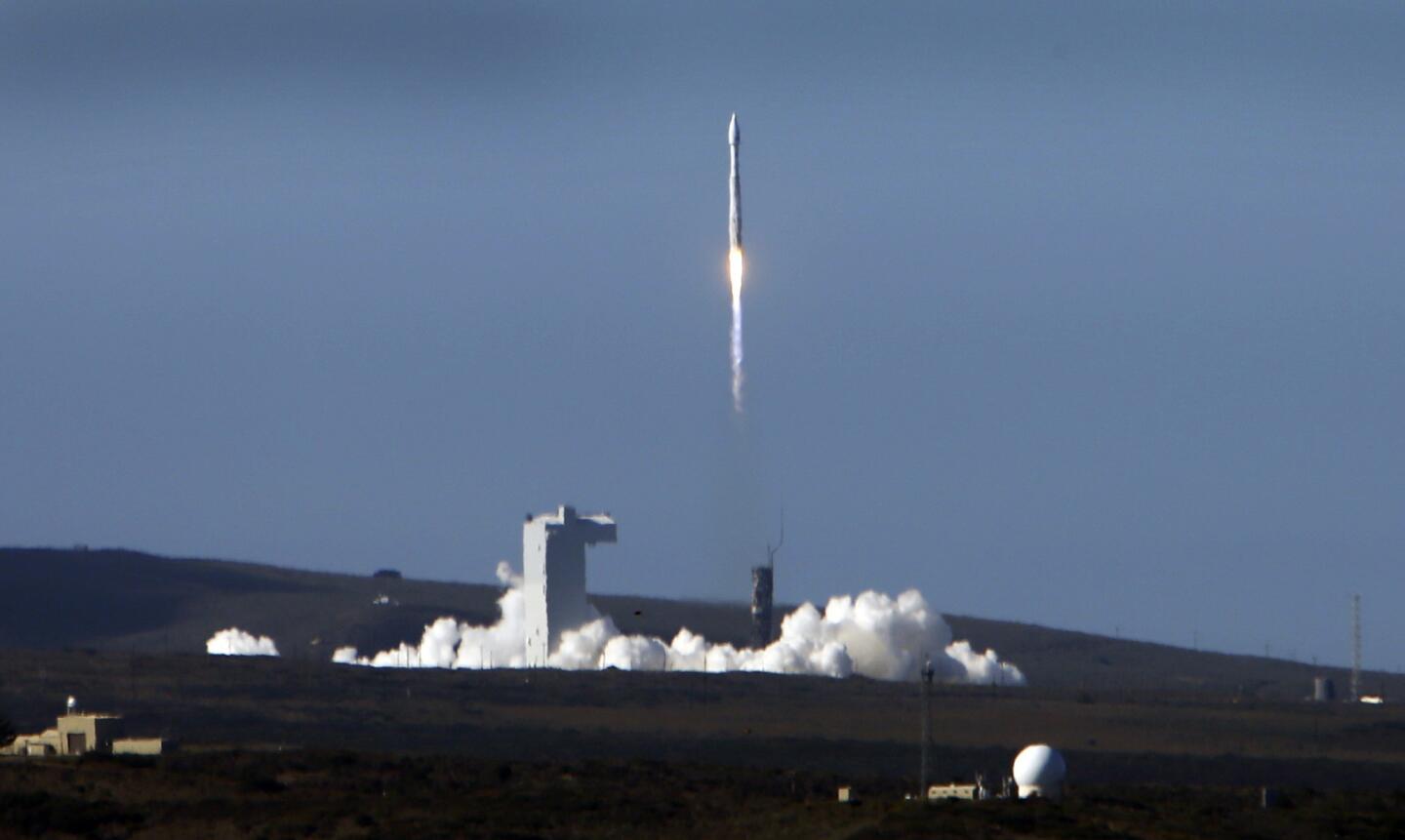 The Atlas V rocket carrying a NASA and USGS Landsat 8 satellite lifts off from Vandenberg Air Force Base.