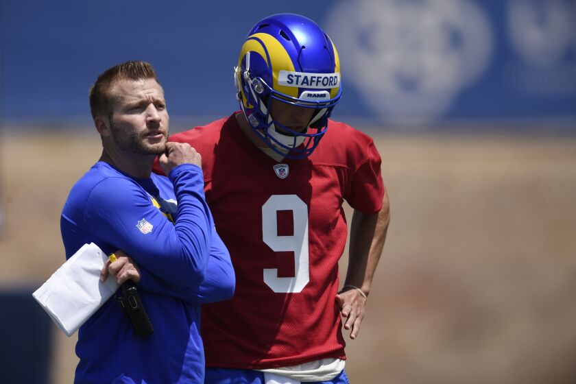 Los Angeles Rams head coach Sean McVay, left, speaks with Matthew Stafford during NFL football practice in Thousand Oaks, Calif., Thursday, May 27, 2021. (AP Photo/Kelvin Kuo)