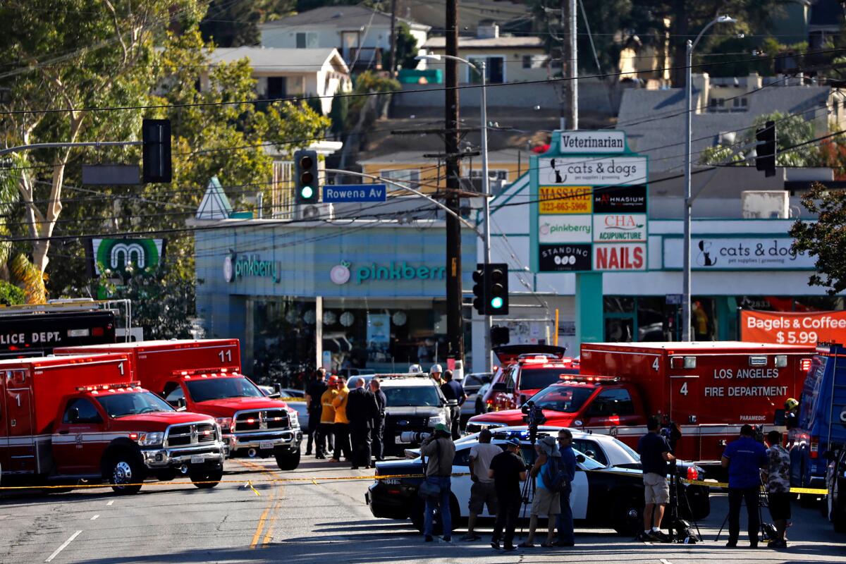 Los Angeles police on Saturday chased a suspect from Hollywood to Silver Lake, where he shot at officers outside the Trader Joe's on Hyperion Avenue.