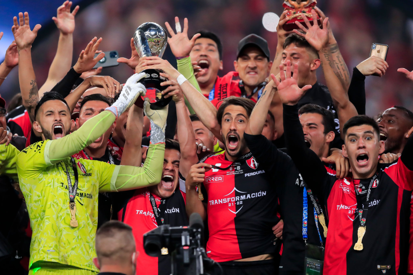 Atlas players celebrate after defeating León in a penalty shootout for the Liga MX title on Sunday night.