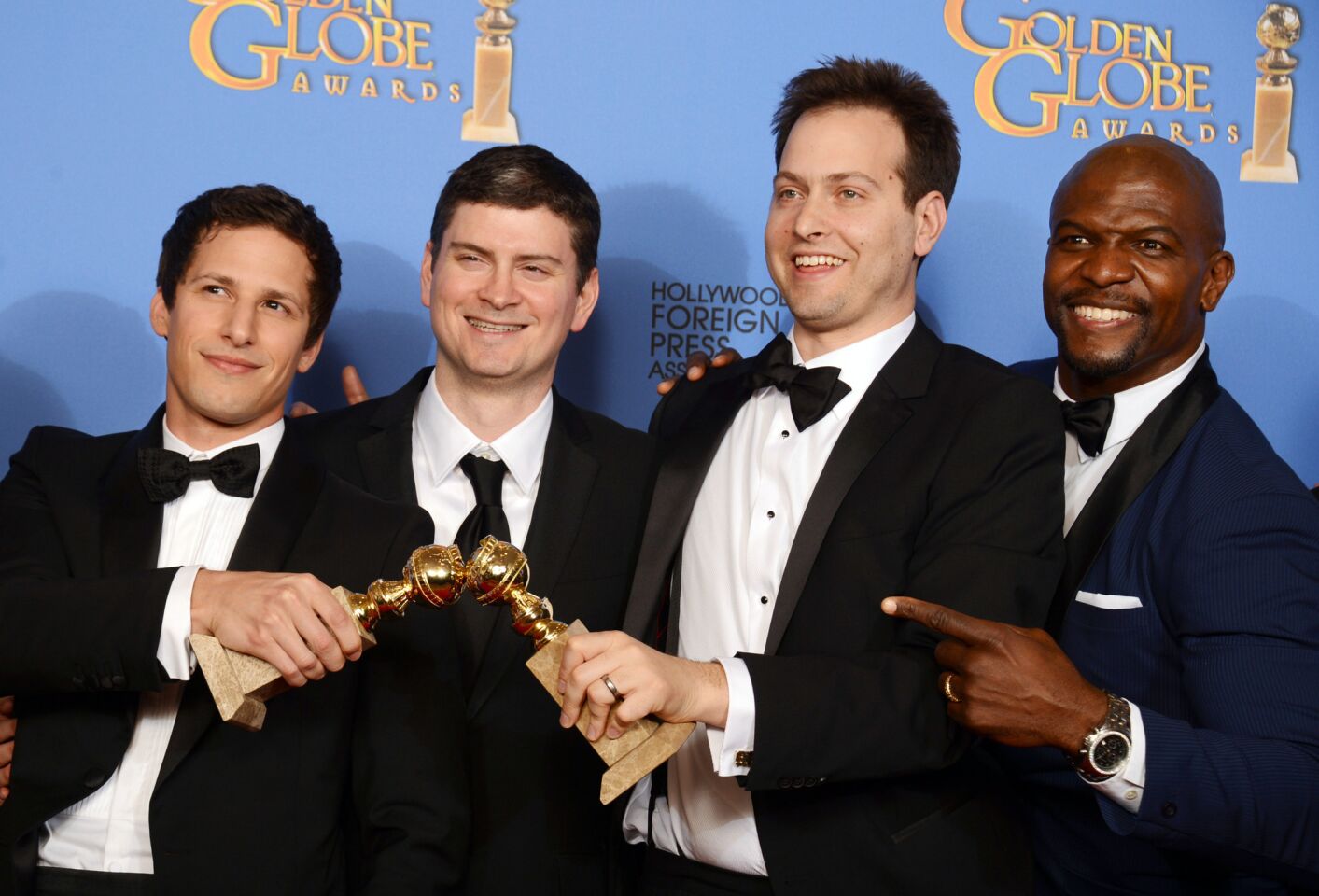 "Brooklyn Nine-Nine" creators after their comedy series win. "We're very stunned, very grateful, very happy," Goore said. "Too many verys. It's hyperbole city." " We built the show around Andy," Schuur explained. "Andre [Braugher] was the last person on the list. We skyped with him to get to know him. About 10 seconds in, he made this joke and cracked this enormous smile that blinded us through our computer screen. We knew immediately that was our guy. Thankfully he said yes." "Everything about the TV business is mysterious and unknowable," Schuur said when asked about the uncertainty of the show's future. "The real answer is, we don't take anything for granted. But those kind of decisions are made in April and May. We just keep on trying to make the best show we can."
