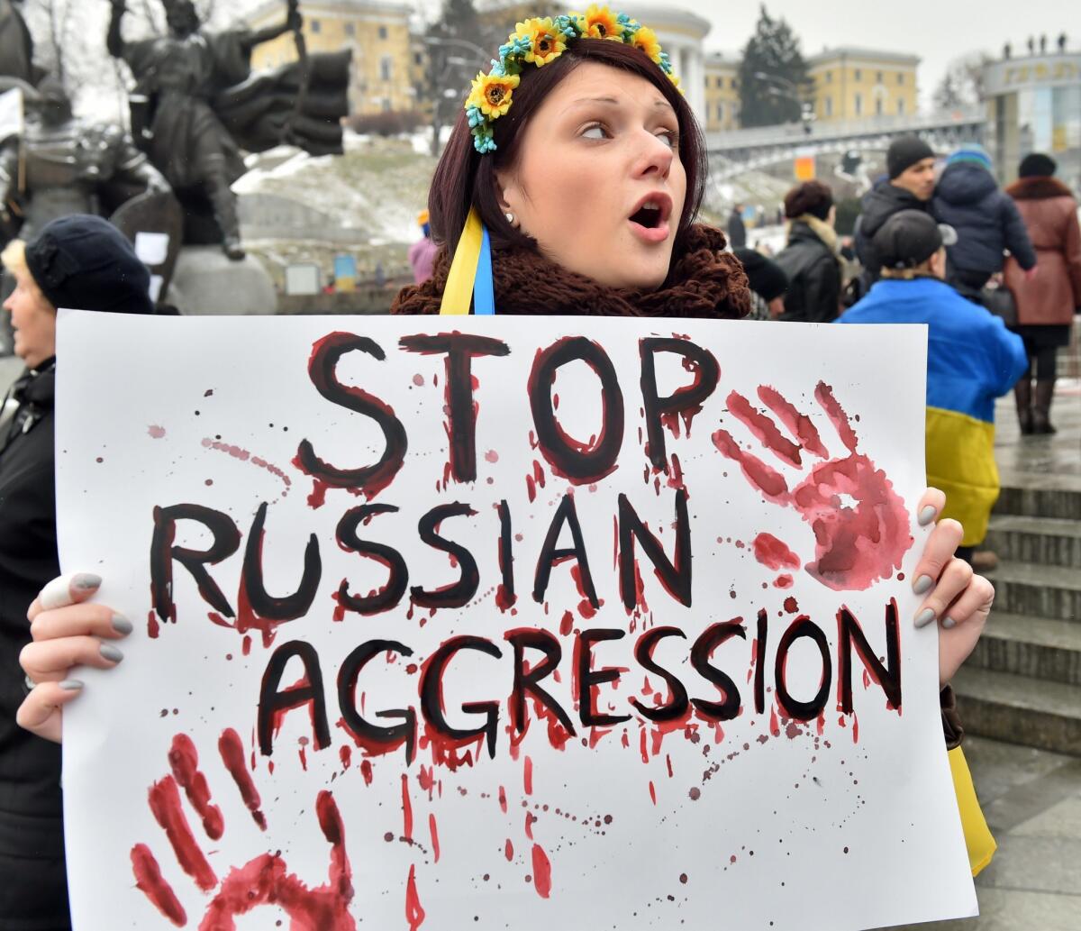 Demonstrators rally in Kiev after last weekend's shelling that left at least 30 people dead and more than 100 injured in the Ukrainian-controlled port of Mariupol.