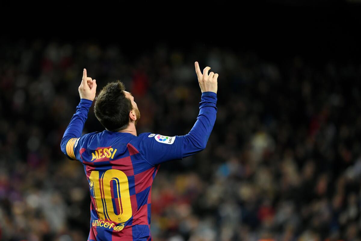 TOPSHOT - Barcelona's Argentine forward Lionel Messi celebrates scoring the opening goal during the Spanish league football match between FC Barcelona and Granada FC at the Camp Nou stadium in Barcelona on January 19, 2020. (Photo by LLUIS GENE / AFP) (Photo by LLUIS GENE/AFP via Getty Images) ** OUTS - ELSENT, FPG, CM - OUTS * NM, PH, VA if sourced by CT, LA or MoD **