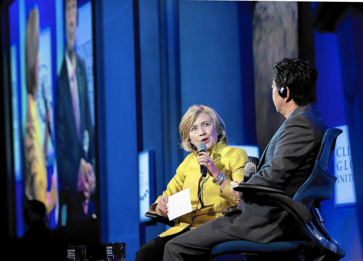 Hillary Rodham Clinton speaks with Japanese Prime Minister Shinzo Abe during the three-day Clinton Global Initiative gathering in New York.