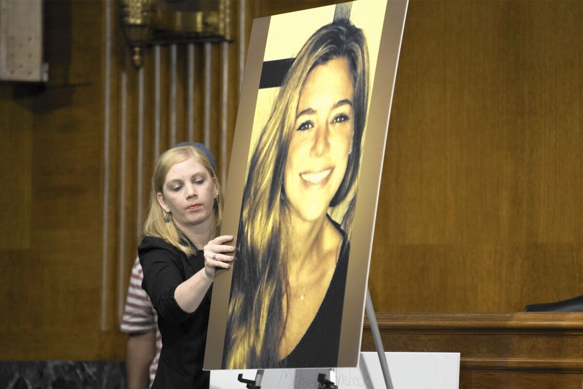 A photo of Kathryn Steinle is displayed at a Senate Judiciary Committee hearing in Washington. Steinle was shot and killed on San Francisco's Pier 14 on July 1. The immigrant felon charged in her death had been deported five times to his native Mexico.