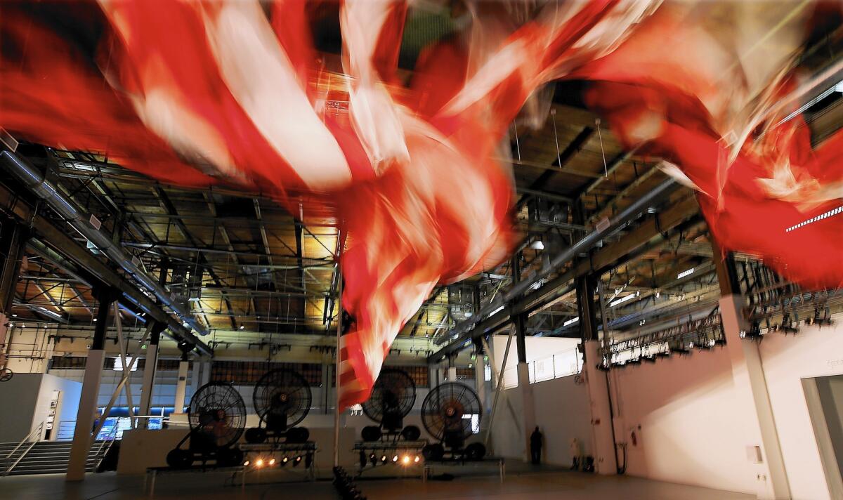 The anchor of MOCA's exhibition of William Pope.L's work is "Trinket"(2008), an enormous U.S. flag buffeted by fans and lights.