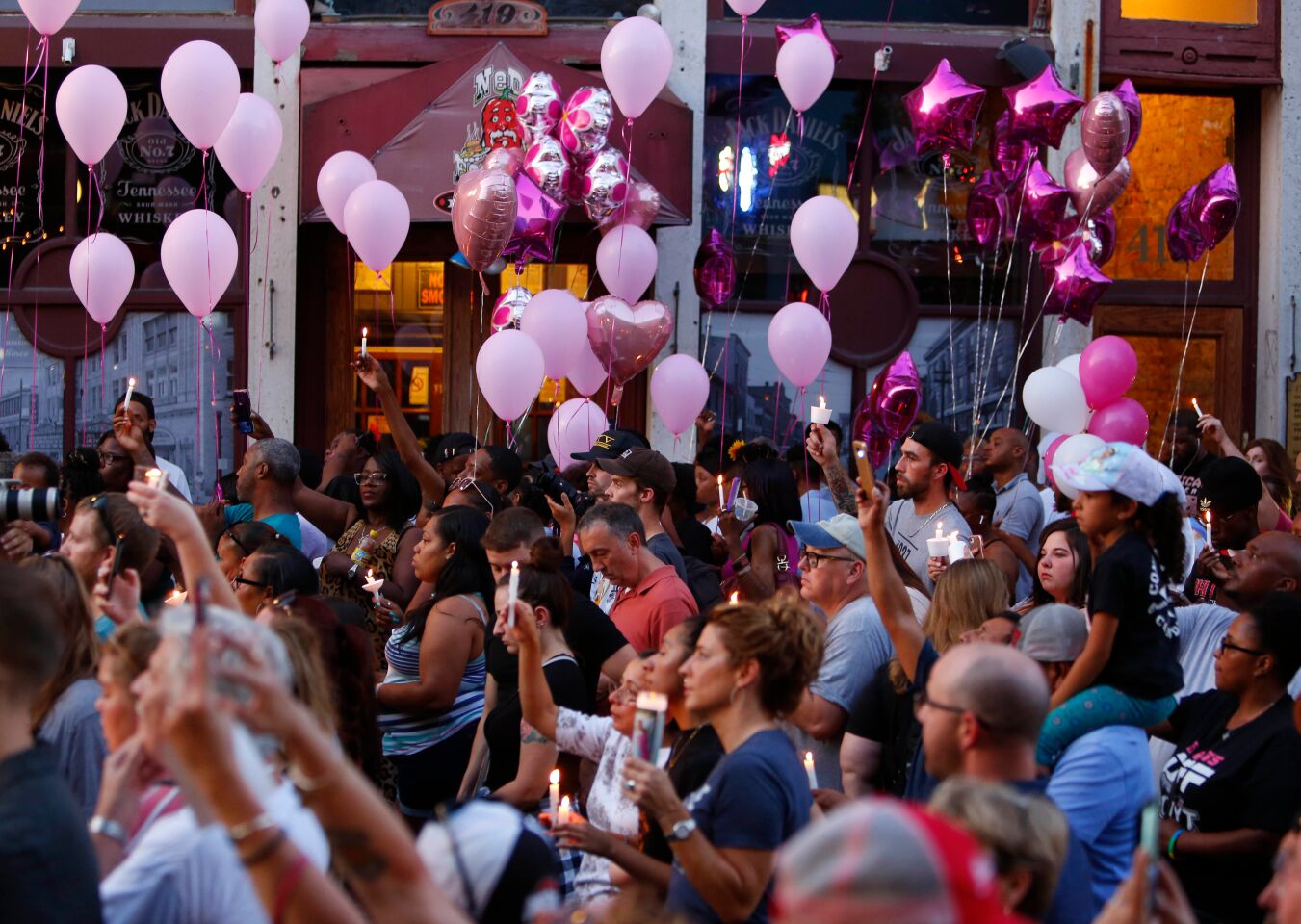 People fill the streets during a vigil after a shooting in the Oregon District of Dayton, Ohio.