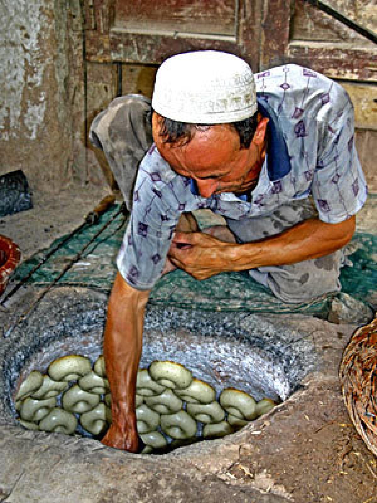 HOT COMMODITY: The formed, but never boiled, dough adheres to the walls of an oven.