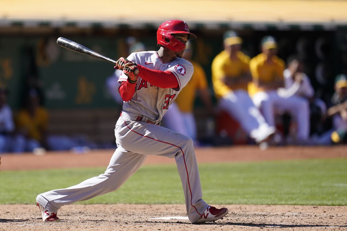 Los Angeles Angels' Magneuris Sierra watches his RBI double during the twelfth inning of a baseball game against the Oakland Athletics in Oakland, Calif., Wednesday, Aug. 10, 2022. (AP Photo/Jeff Chiu)