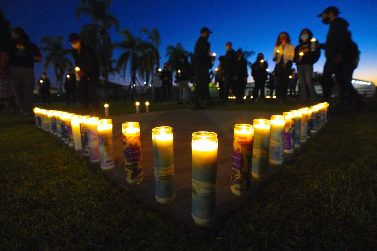 Supporters with candles showing support for SURJ San Diego in support of Defend Black Immigrants National Day of Action