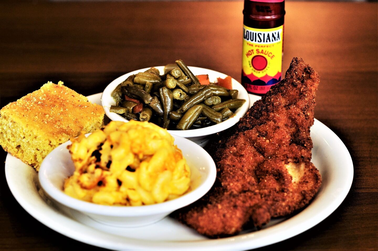 Josephine's Cooking recently got a facelift from Food Network's show "Restaurant Impossible," but thankfully its menu hasn't deviated from its soul food favorites. Get the fried catfish fillet ($12.95), coated in cornmeal and fried until it's a deep brown while still flaky and moisture-laden inside. For your sides, don't miss the green beans, stewed with bacon until soft, or the mac and cheese. But make sure you save room for dessert because the peach cobbler ($4) is every bit as comforting as it sounds with ooey gooey filling and a chewy biscuit top. 436 E. 79th St., 773-487-2900 — Grace Wong
