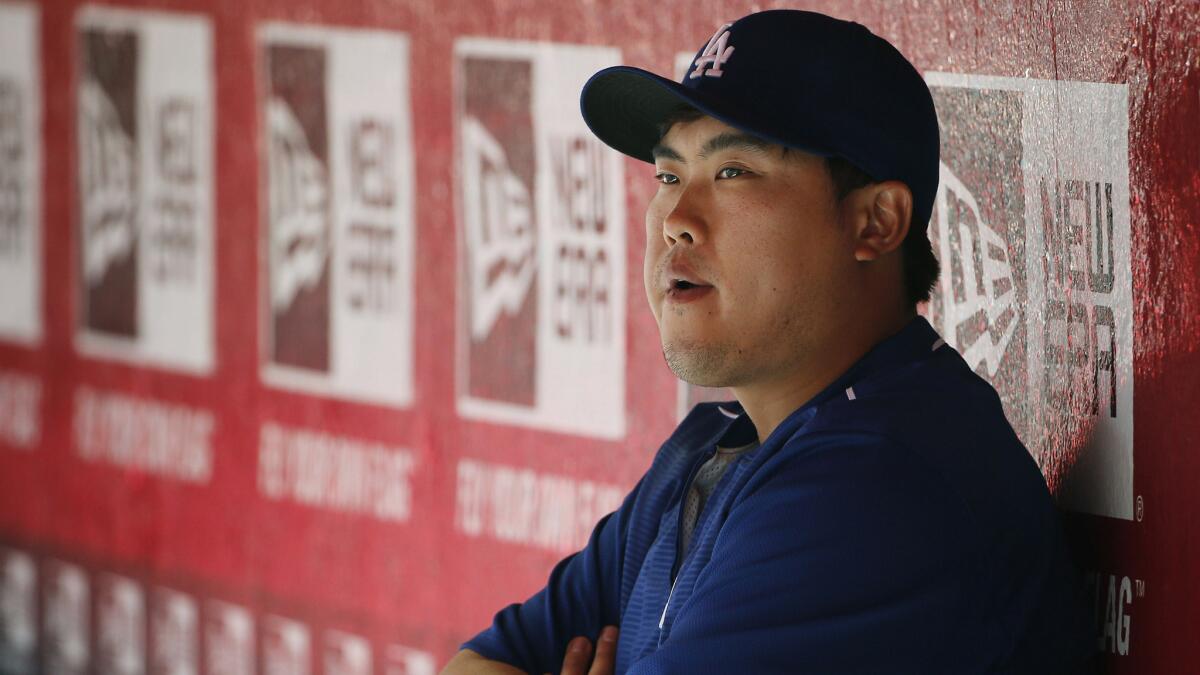 Injured Dodgers starting pitcher Hyun-Jin Ryu watches from the dugout during a game against the Arizona Diamondbacks on April 12.