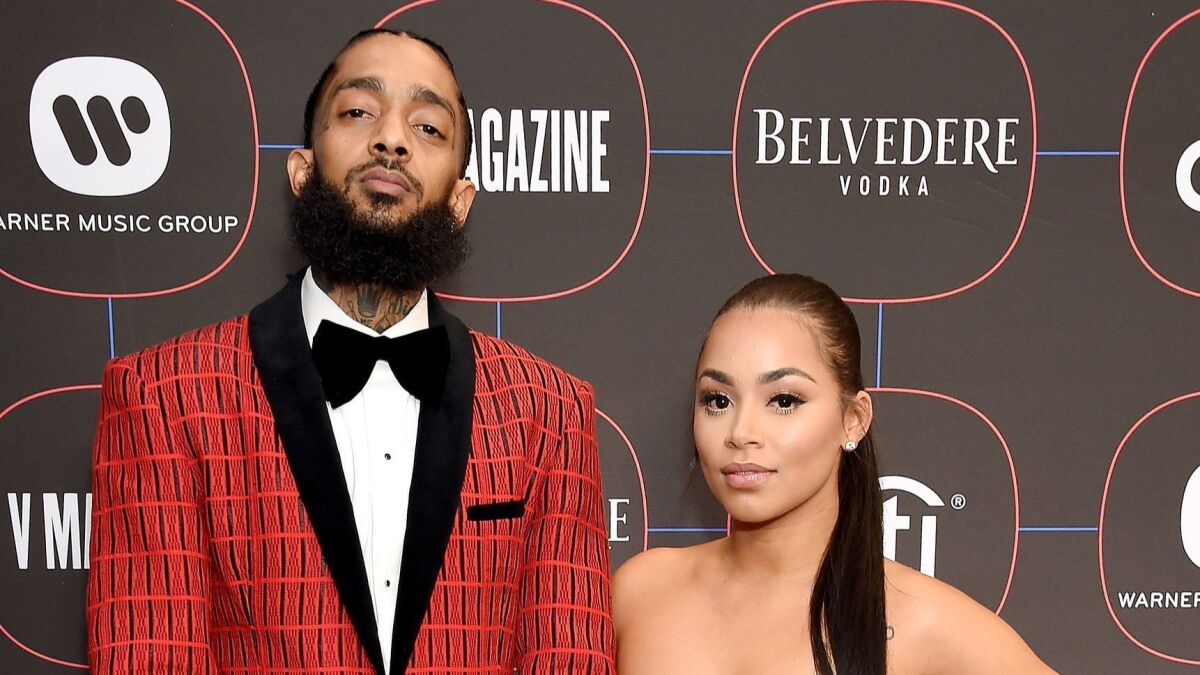 Nipsey Hussle and longtime girlfriend Lauren London arrive at the Nomad Hotel Los Angeles in February.