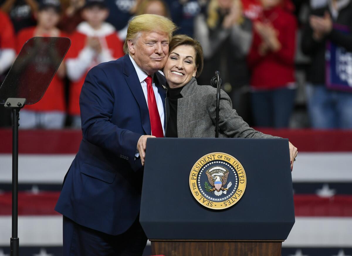 President Trump with Iowa Gov. Kim Reynolds during a campaign rally Thursday at Drake University in Des Moines.