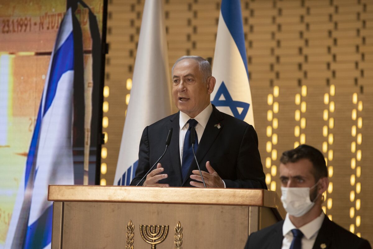 Israeli Prime Minister Benjamin Netanyahu speaks at a Memorial Day ceremony at the military cemetery in Jerusalem. 