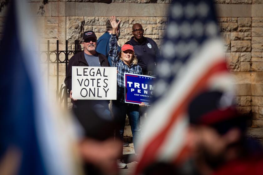 ATLANTA, GA - NOVEMBER 18: Trump supporters attend the Stop the Steal rally at the Georgia Capitol Building on Wednesday, Nov. 18, 2020 in Atlanta, GA. (Jason Armond / Los Angeles Times)