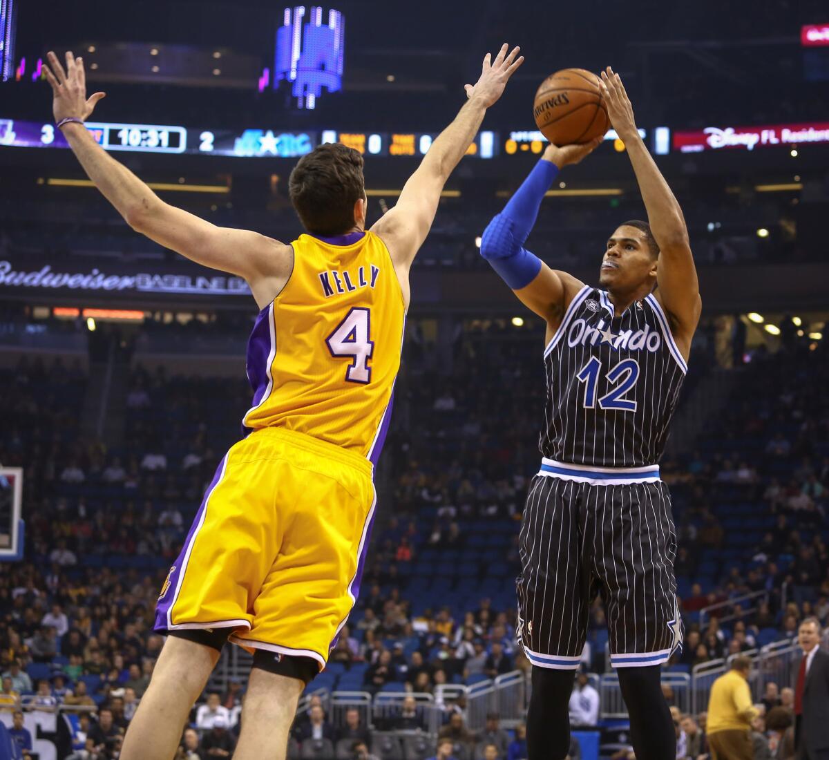 Magic forward Tobias Harris shoots over the outstretched hand of Lakers forward Ryan Kelly last season.