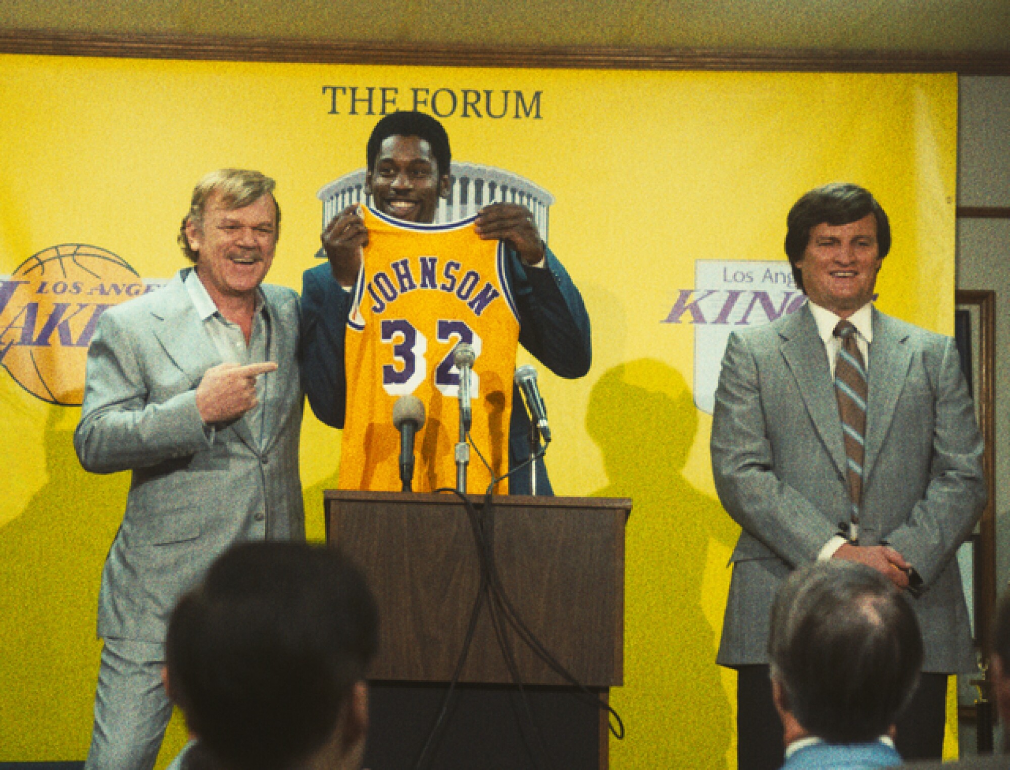 'Winning Time' HBO: True story of Magic Johnson, Jerry Buss - Los Angeles Times 3 Three men hold a press conference before a yellow background