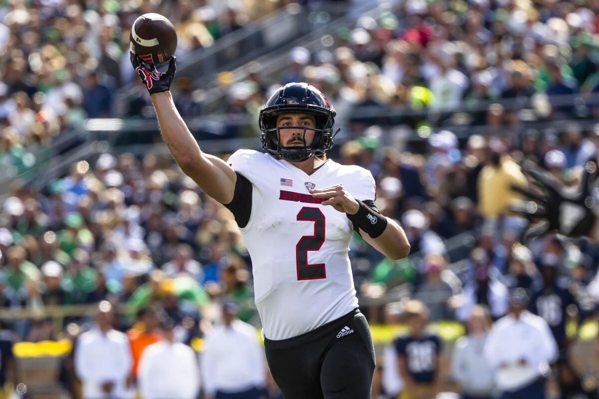 Northern Illinois quarterback Ethan Hampton throws a pass against Notre Dame.