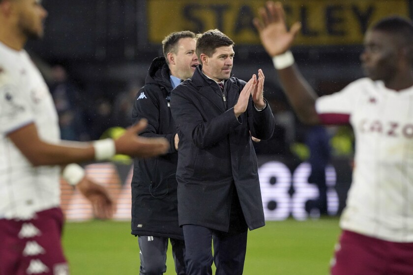 Aston Villa manager Steven Gerrard celebrates his side's 2-1 win after the final whistle of the British Premier League soccer match between Crystal Palace and Aston Villa at Selhurst Park, London, Saturday, Nov. 27, 2021. (Jonathan Brady/PA via AP)