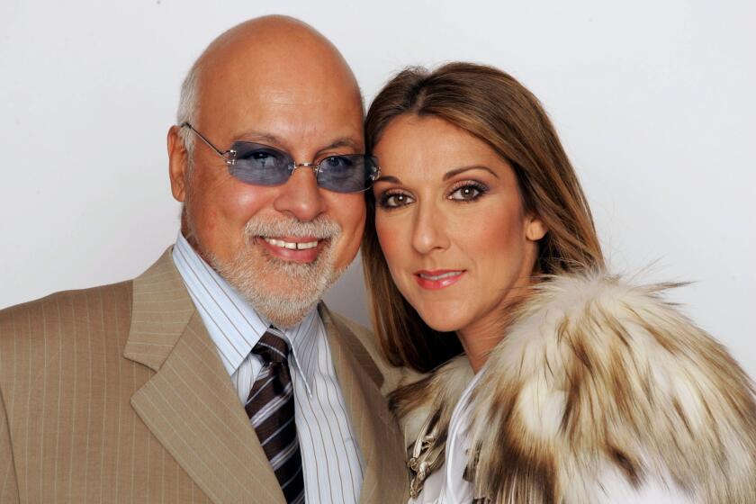 Celine Dion and her husband, René Angélil, attend the 2004 World Music Awards in Las Vegas. Angélil, 73, died Thursday.