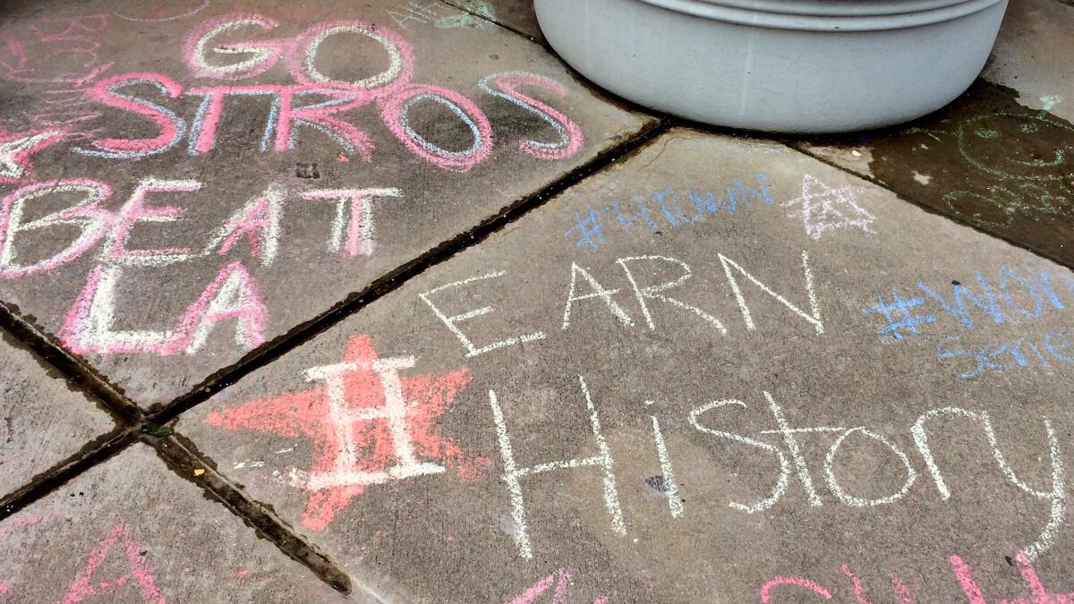 Students at Incarnate Word Academy showed their support in chalk on the sidewalks at school.