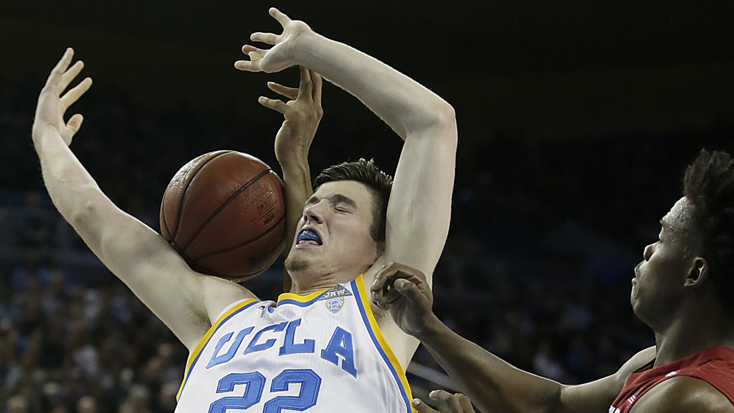 UCLA forward TJ Leaf can't pull in a rebound against Stanford guard Marcus Allen during the first half.