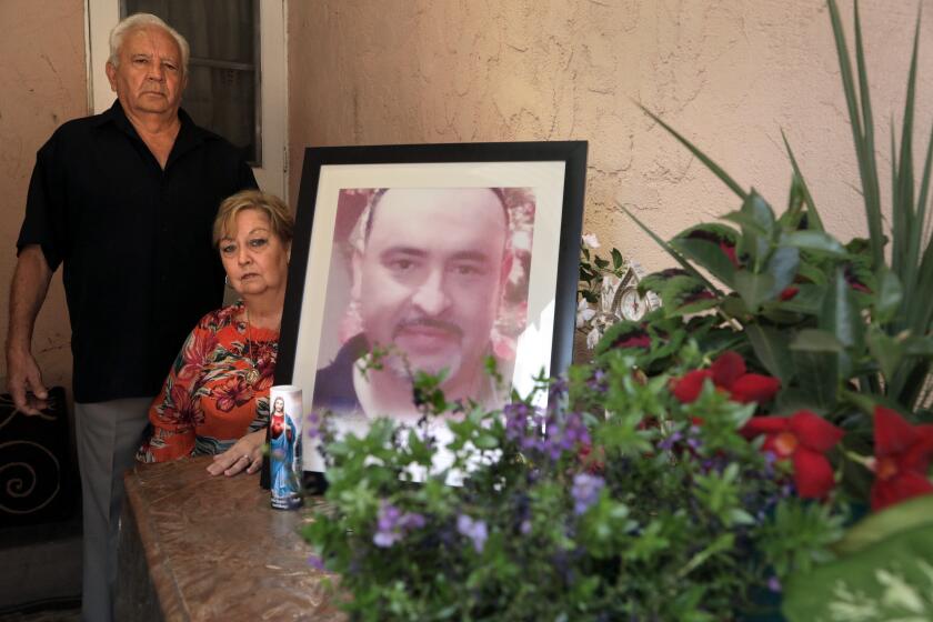 MAYWOOD, CA - SEPTEMBER 01: Juan and Blanca Briceno created a shrine for their son Eric Briceno who was killed by deputies in March during a mental health call. Photographed at Briceno home on Tuesday, Sept. 1, 2020 in Maywood, CA. (Myung J. Chun / Los Angeles Times)