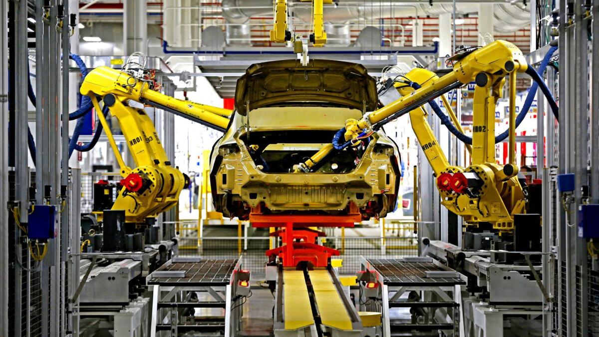 Assembly line robots inside a Chrysler plant in Sterling Heights, Mich. As automation increases, remaining workers will need to demonstrate complex reasoning, experts say.