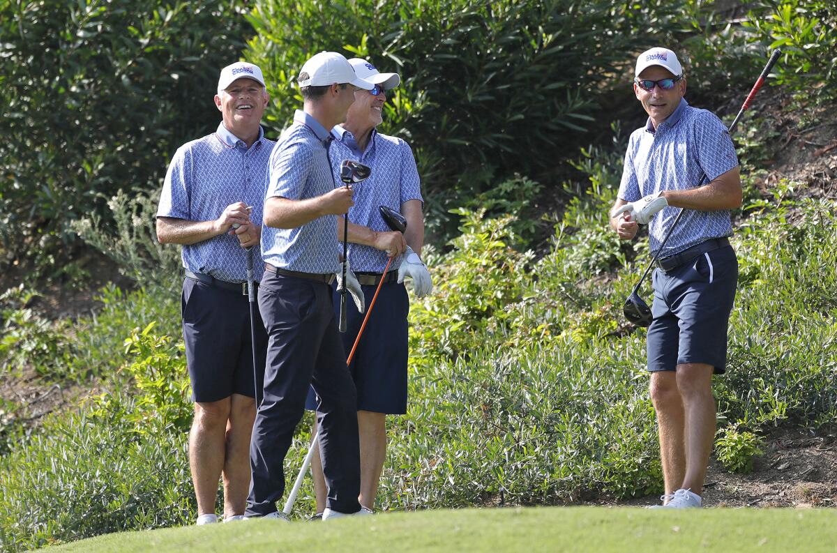 Members of the Shady Canyon team smile as they walk onto the tee box on Thursday.