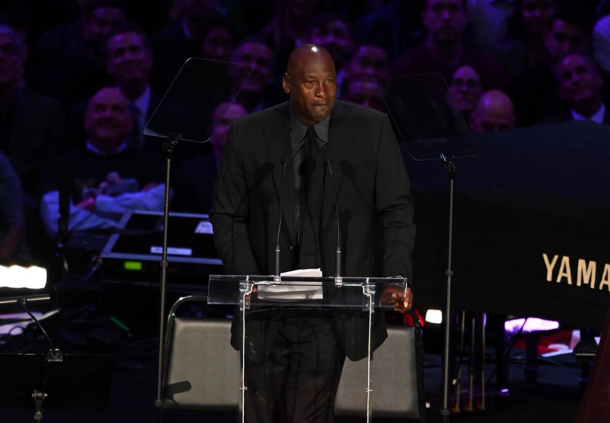 Michael Jordan pauses for a moment during his tearful speech about "little brother" Kobe Bryant.