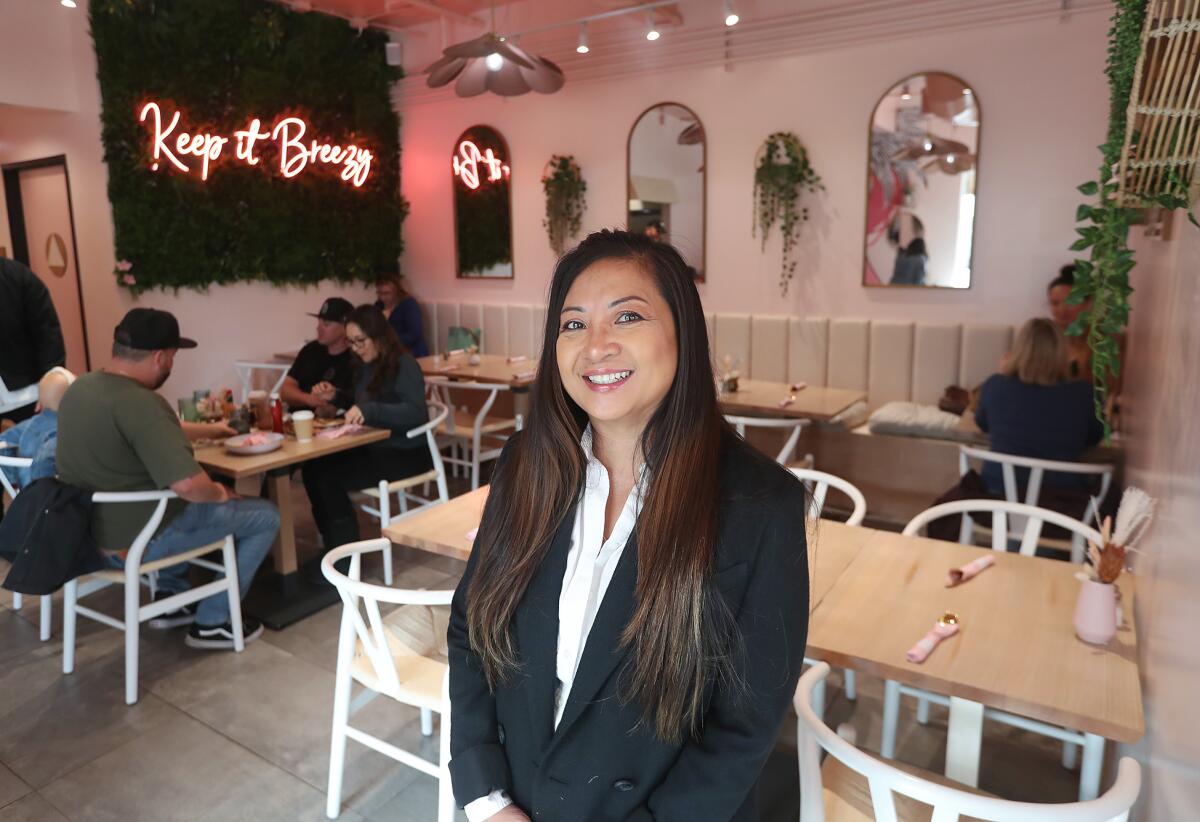 Jasmin Gonzalez stands at her new Breezy restaurant in downtown San Juan Capistrano. 