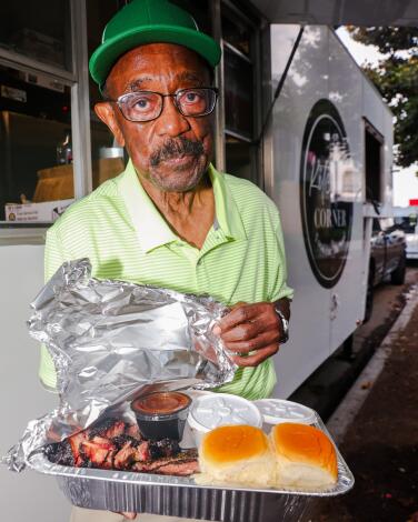 Al Mayfield, 88, displays his order at Kitchen’s Corner BBQ