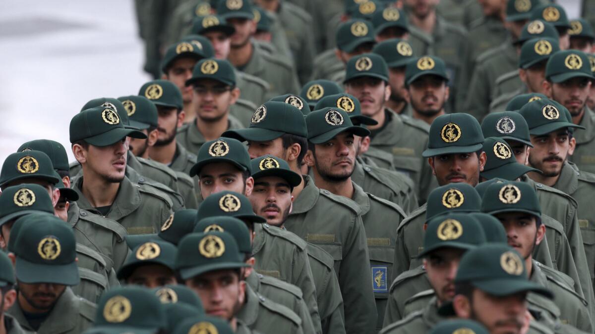 Iranian Revolutionary Guard members arrive for a ceremony celebrating the 40th anniversary of the Islamic Revolution, at the Azadi, or Freedom, Square, in Tehran on Feb. 11.