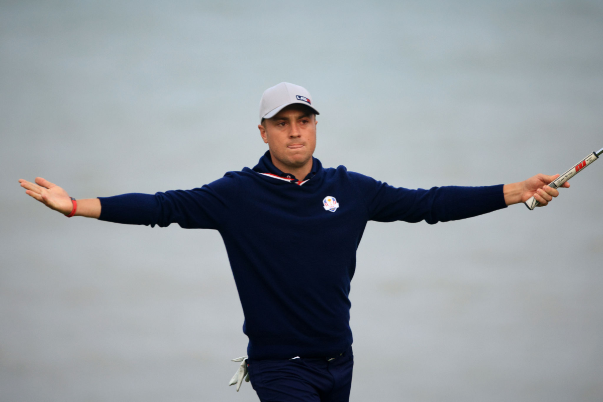 Justin Thomas reacts after sinking an eagle putt on the 16th hole at the Ryder Cup on Friday.