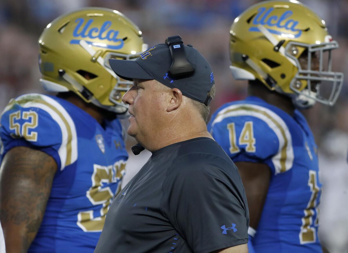 Chip Kelly works the sideline in his first game as UCLA's head coach at the Rose Bowl in Pasadena on Saturday.