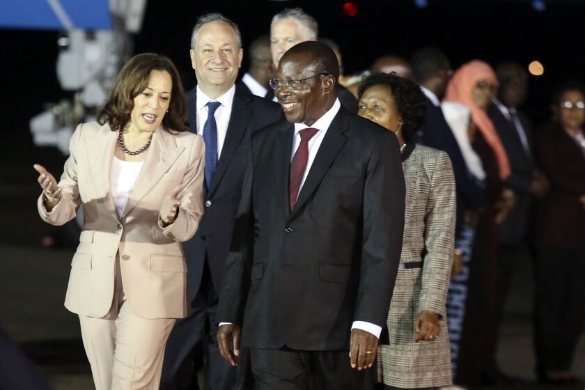 Vice President Kamala Harris talks with Tanzania's Vice President Philip Mpango as she arrives at the Julius Nyerere Airport in Dar es Salaam, Tanzania, Wednesday, March 29, 2023, the second stop of a three-nation tour of Africa. (Emmanuel Herman/Pool Photo via AP)