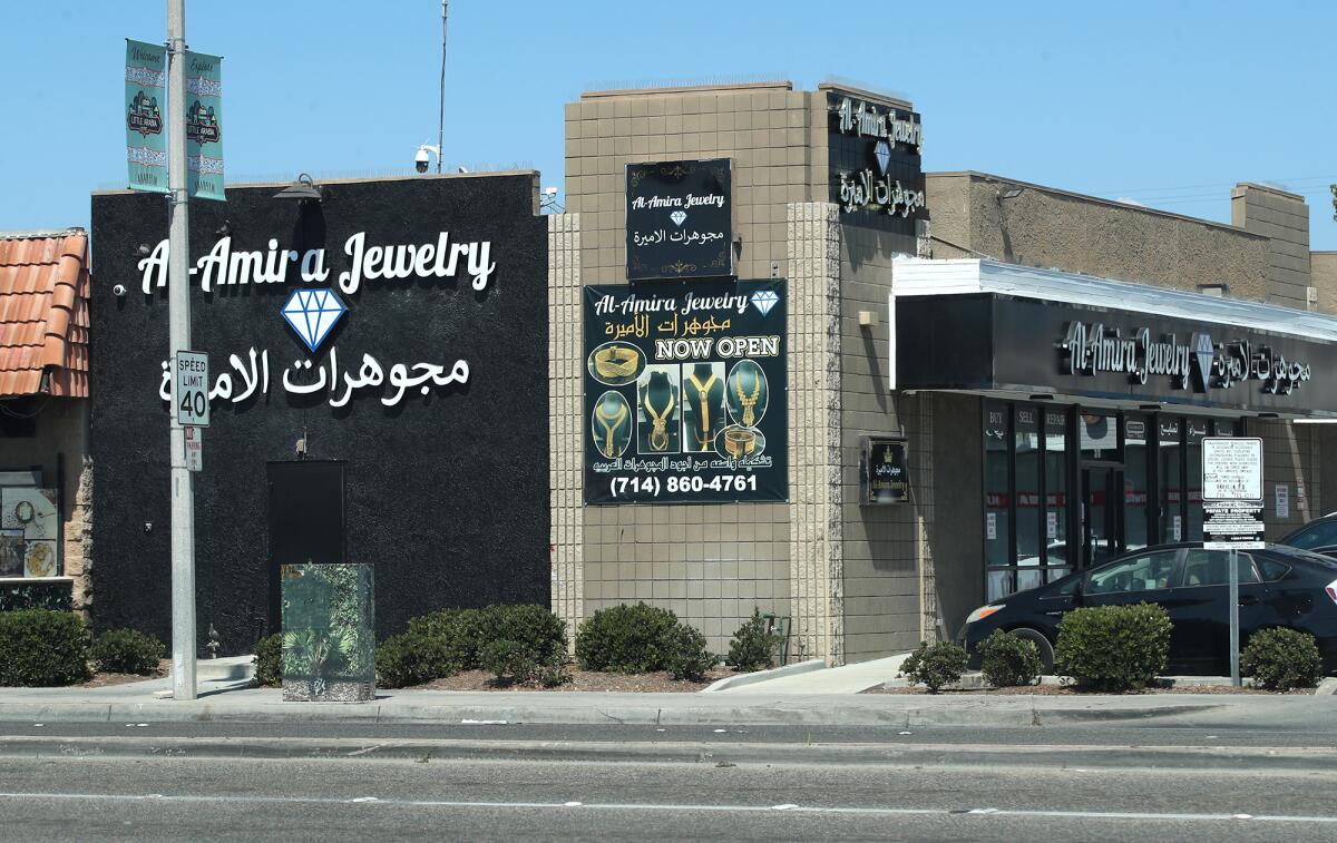 New "Little Arabia" banners hang over where the "Hijabi Queens" mural once stood.