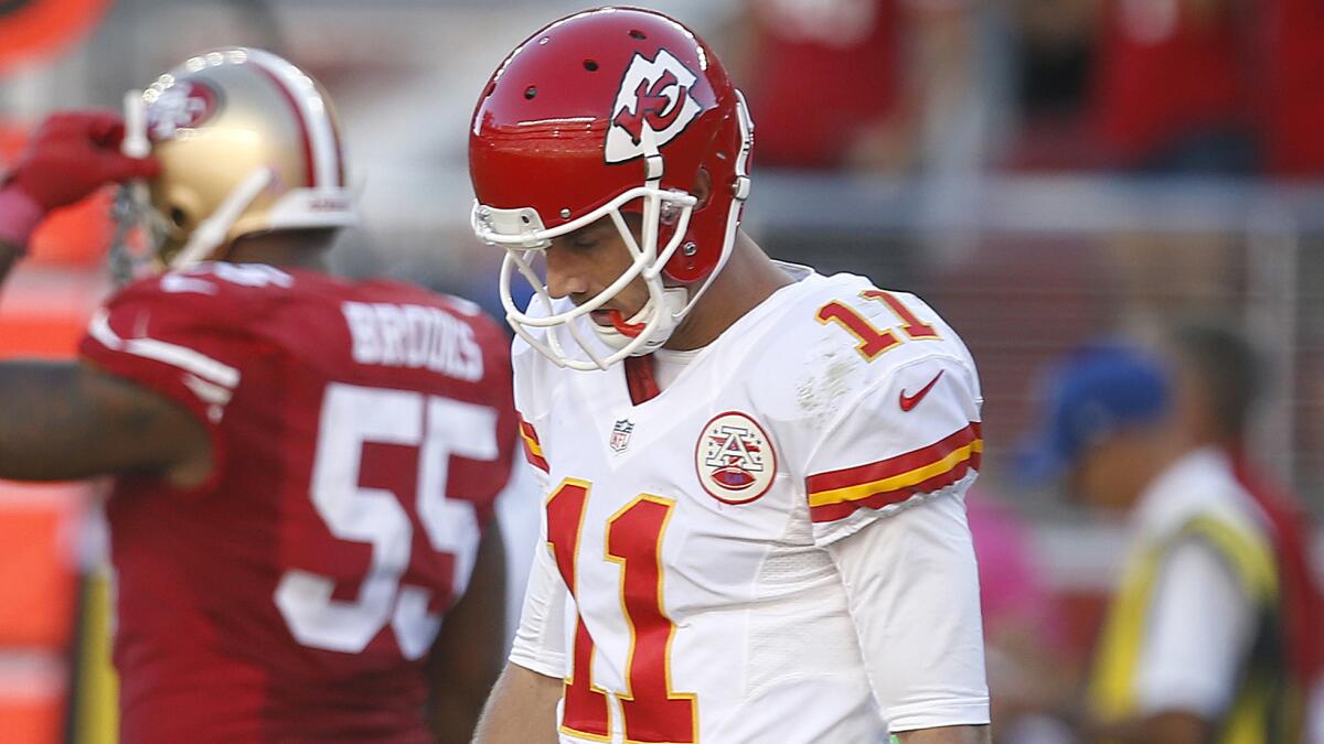 Kansas City Chiefs quarterback Alex Smith walks off the field after throwing a late interception during Sunday's loss to the San Francisco 49ers.